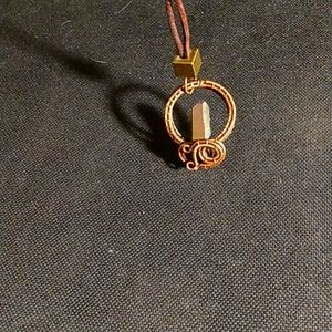 Wire wrapped crystal talisman and leather cord